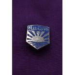 An Albion lapel badge.
