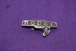 A Dodge lapel badge.