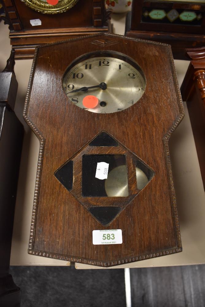 A wood framed wall clock