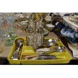 A selection of cutlery and flatware loose also condiment set