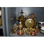 A fine selection of brass and copper items including dinner gong spirit kettle with stand and copper