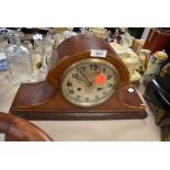 An inlaid wooden mantel clock