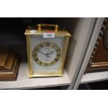 A seiko brass effect mantel clock