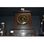 A Victorian gothic mantle clock having slate and marble case with brass and painted face by Mappin