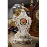 A ceramic mantel clock made in Italy with a German movement