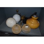 A selection of vintage light and lamp shades including milk glass brass fitment and Guzzini style