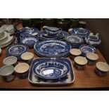 A good selection of blue and white willow wear dinner and tea wears including Royal Tudor wear