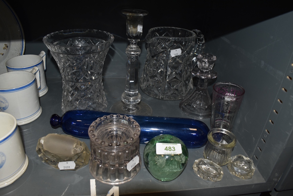 A selection of glass wares including cut candle sticks water jug and vase etc