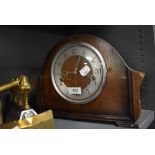 A Smiths style mantle clock having oak case with chime