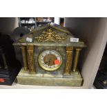 A marble mantel clock with green pillar design by W H Skinner of St Leonards on sea