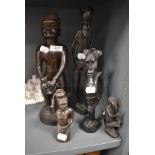 A selection of hand carved African ethnic tribal figures of various designs