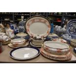 A selection of various tea and dinner wares including tureens and chargers