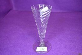 A conical ale or wine glass having a twist design of domed foot