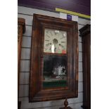 An American 30 hour wall clock by Rome and Co, New haven, Connecticut with enamel face