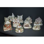 Ten ceramic model figure studies of cottages and buildings by Coalport all in fine condition