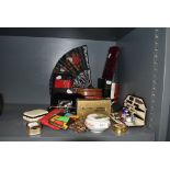 A selection of curios and dressing items including fans coin purse and manicure set