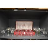 A selection of fine clear cut crystal and etched champagne wine and spirit glasses including Marie