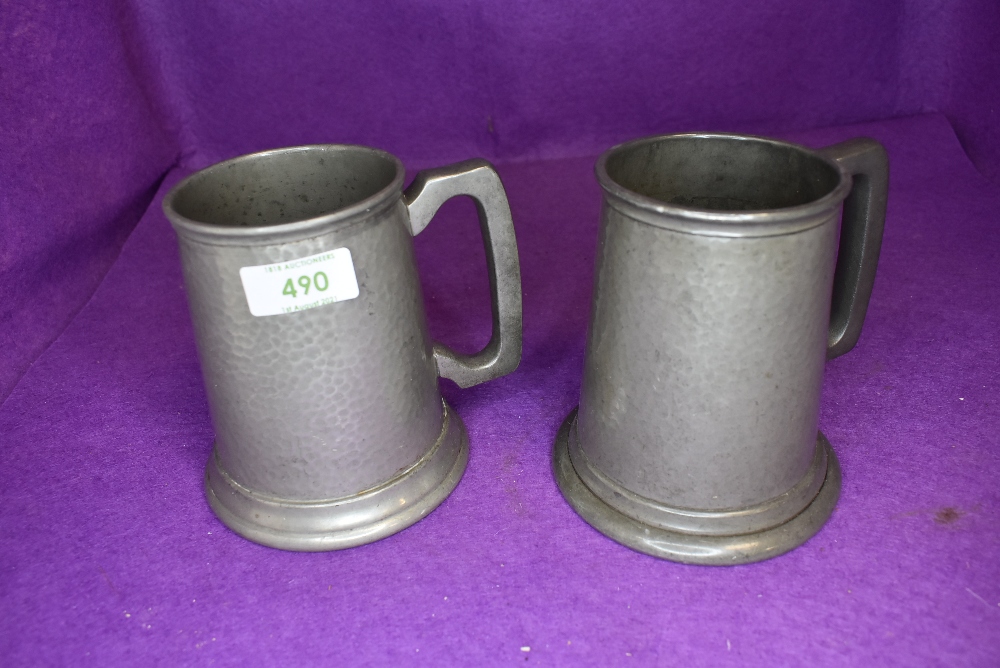 Two pewter beer mugs or tankard one glass bottom and one by Craftsman