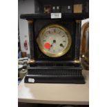 A Victorian 8 day mantel clock in wooden case with enamel face