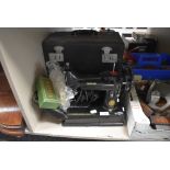A fine example of a 222k portable sewing machine by Singer with case etc