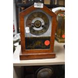 An American wood framed mantel clock