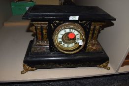 A shelf clock with a German movement