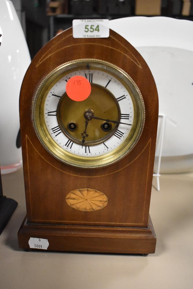 An inlaid bodied mantel clock with an enamel face