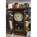 A reproduction quartz movement wall clock