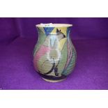 A hand painted art deco styled studio pottery vase marked Caton 5YR to base