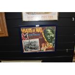 A vintage Italian lobby film poster framed and glazed Vasallos De Mal