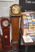 A Granddaughter clock with quartz movement in a 1930's case