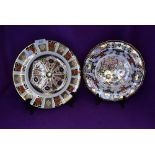Two ceramic display plates by Royal Crown Derby in Imari designs