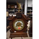 A wood framed mantel clock by Asonia Clock Co, New York with enamel face
