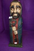 A wooden carved wine or bottle holder in form of a shepherd 40cm tall