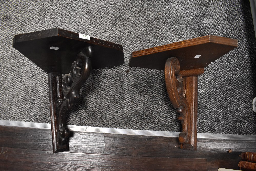 two oak wall sconce or shelf bracket having naturalistic carved support one oak and one dark