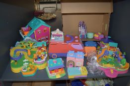 A shelf of Bluebird Polly Pocket accessories and figures along with similar Polly Pocket and Pound