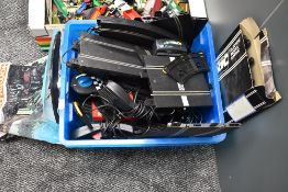 A box of Scalextric track and accessories including two controllers