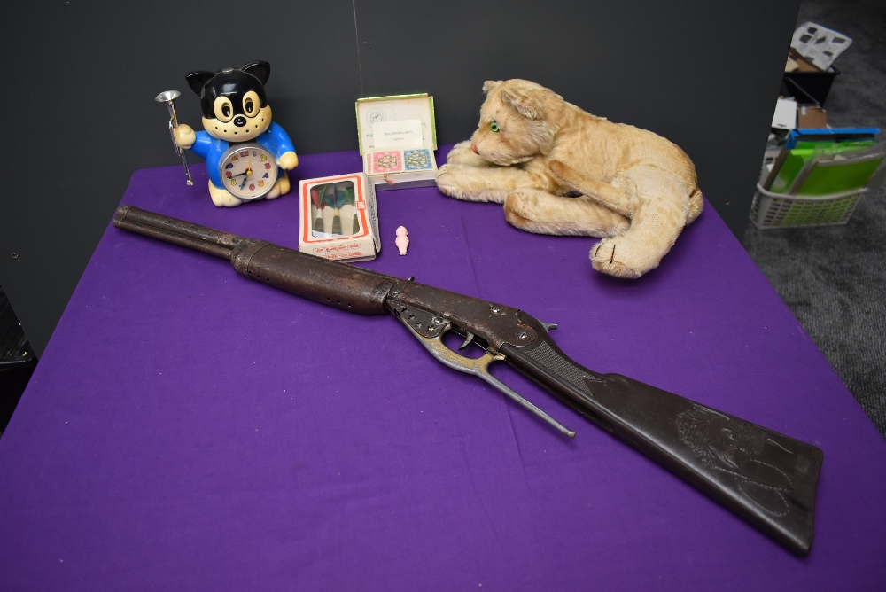 A Steiff style Lion Cub Soft Toy, a Lone Star style Wild West Toy Rifle, a 1980's Quartz Citizen