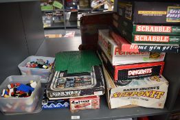 A shelf of mixed vintage Toys and Games including 1970's Lego pieces in plastic boxes, Action GT