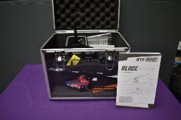 A Spektrum Ultra Micro Collective Pitch Helicopter with remote control unit and case along with