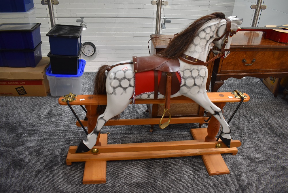 A modern Rocking Horse having name plate for Clive Taylor 1997, dapple grey with horse hair mane and