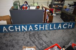 A mid 20th century wooden Railway Station Sign for Achnashellach in blue with white lettering,