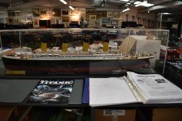 A hand built Hachette scale model, HMS Titanic in plastic display case, length 120cm, height 32cm