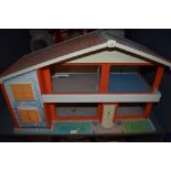 A 1970's wooden and plastic two story My First Home Doll's House