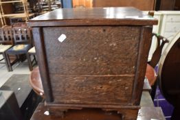 A small oak storage box fabric lined for haberdashery or similar use with open top lid