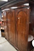 A 19th Century mahogany triple robe, converted from housekeepers cupboard, width approx. 196cm