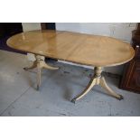 A nice quality reproduction Regency bleached mahogany two part extendable dining table having