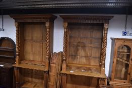 A near pair of 19th Century and later golden oak bookcases, having Corinthian column to base and