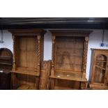 A near pair of 19th Century and later golden oak bookcases, having Corinthian column to base and