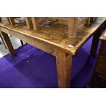 A large rustic kitchen table having grooved (simulated plank) top, on chunky square legs , approx.